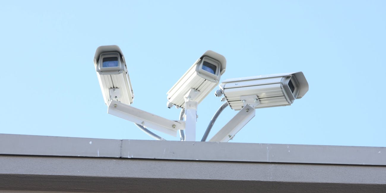 Three security cameras on a roof